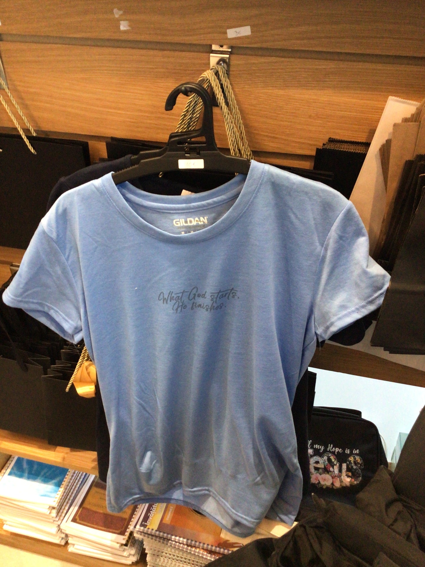 Blue ladies t-shirt “What God starts”