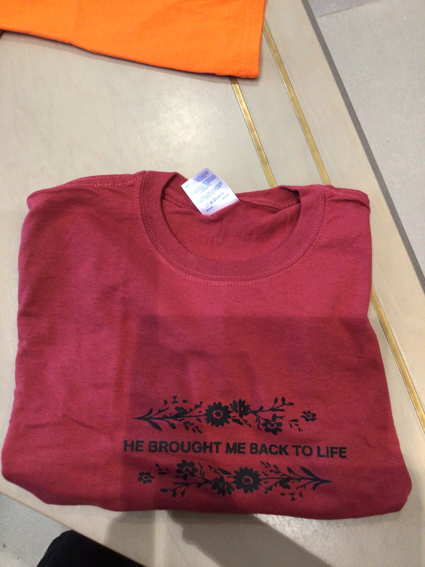 Red t-shirt “He brought me back to life”
