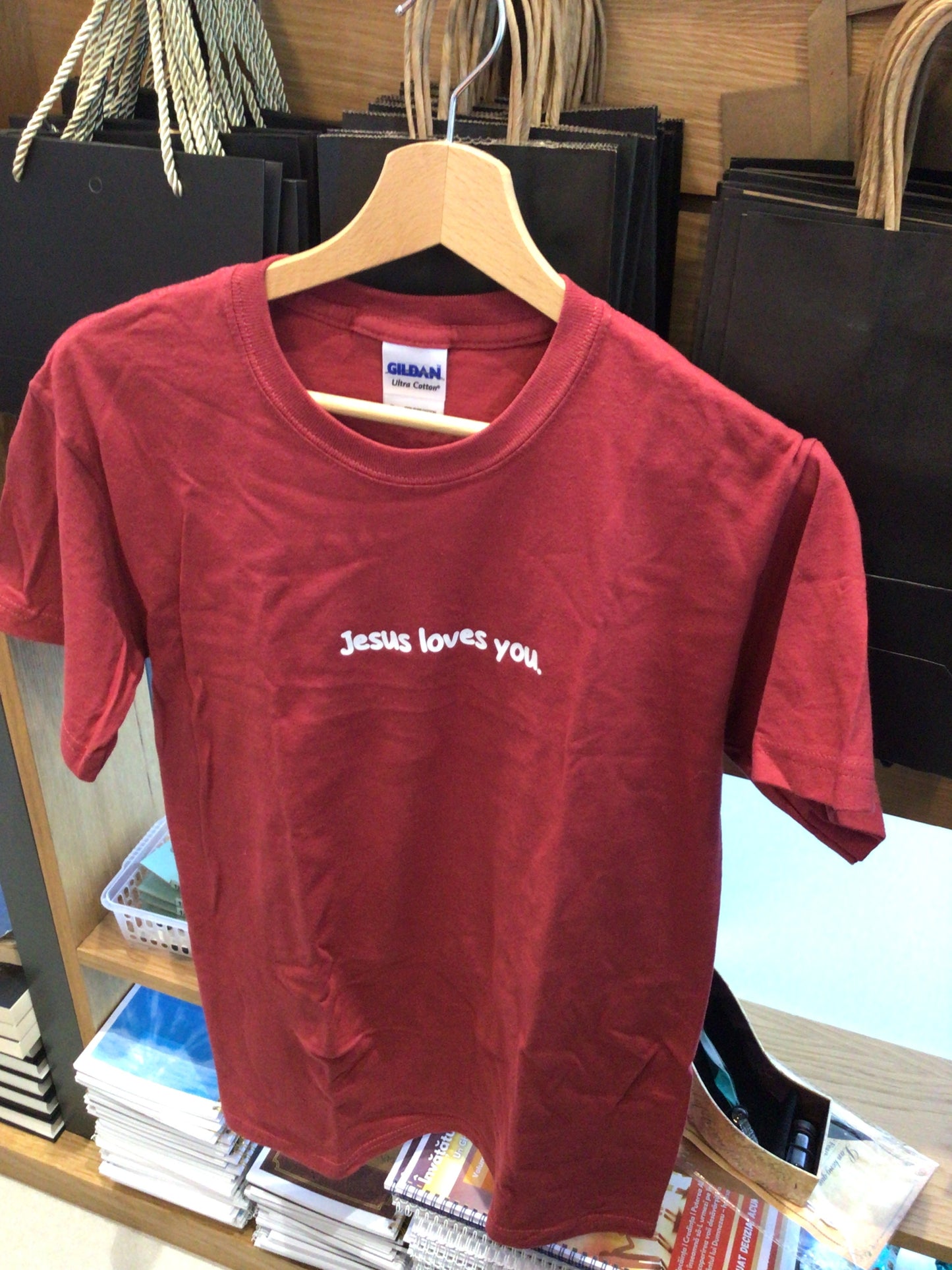 Red t-shirt “Jesus loves you”
